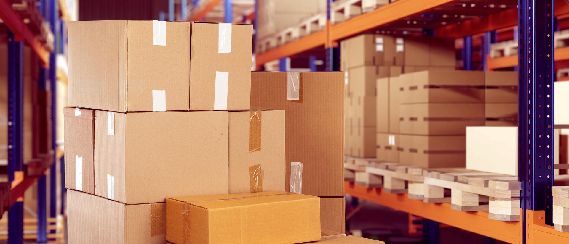 Shipping boxes stacked in a warehouse.